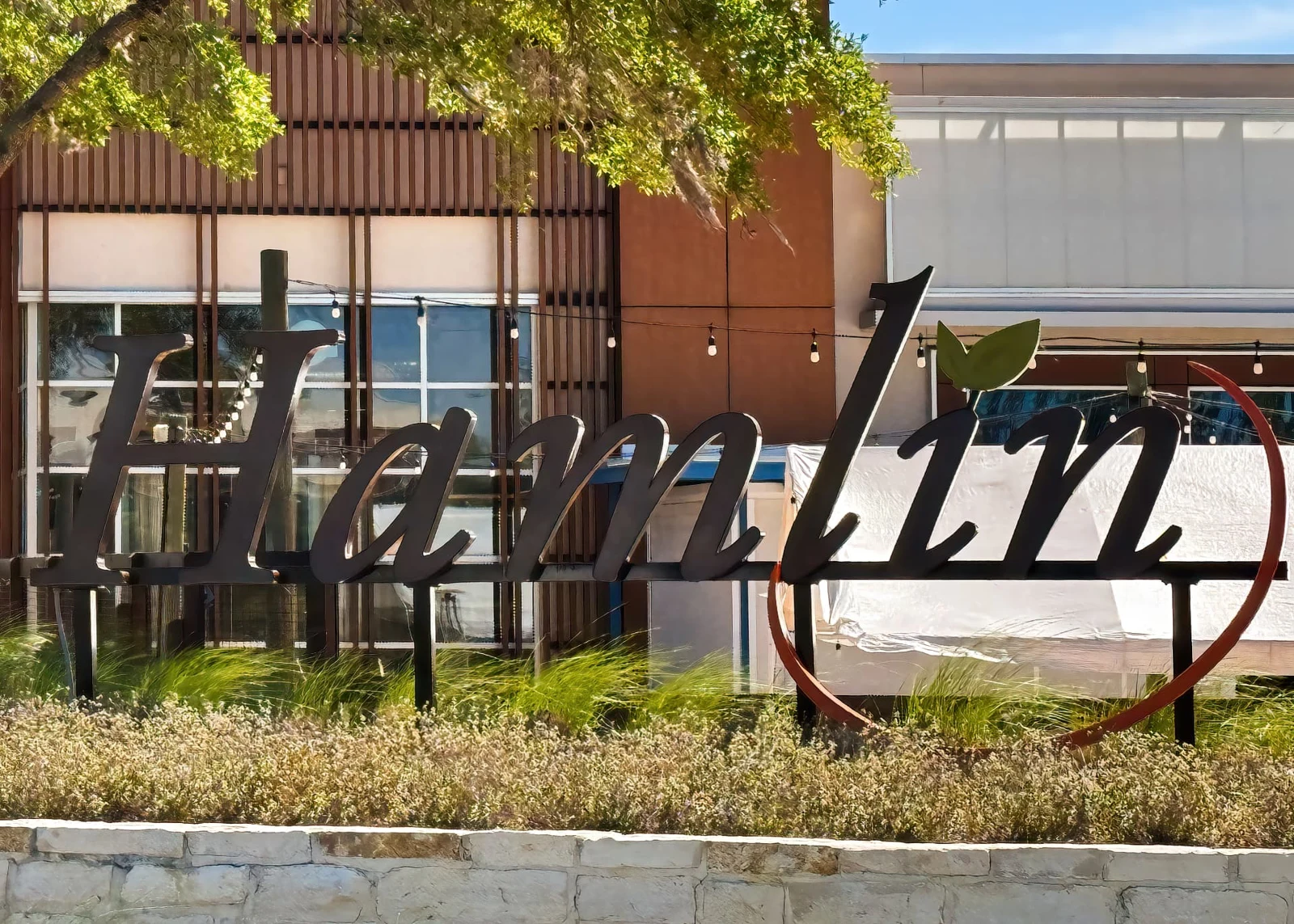 The Hamlin sign in Horizon West, surrounded by trees and landscaping
