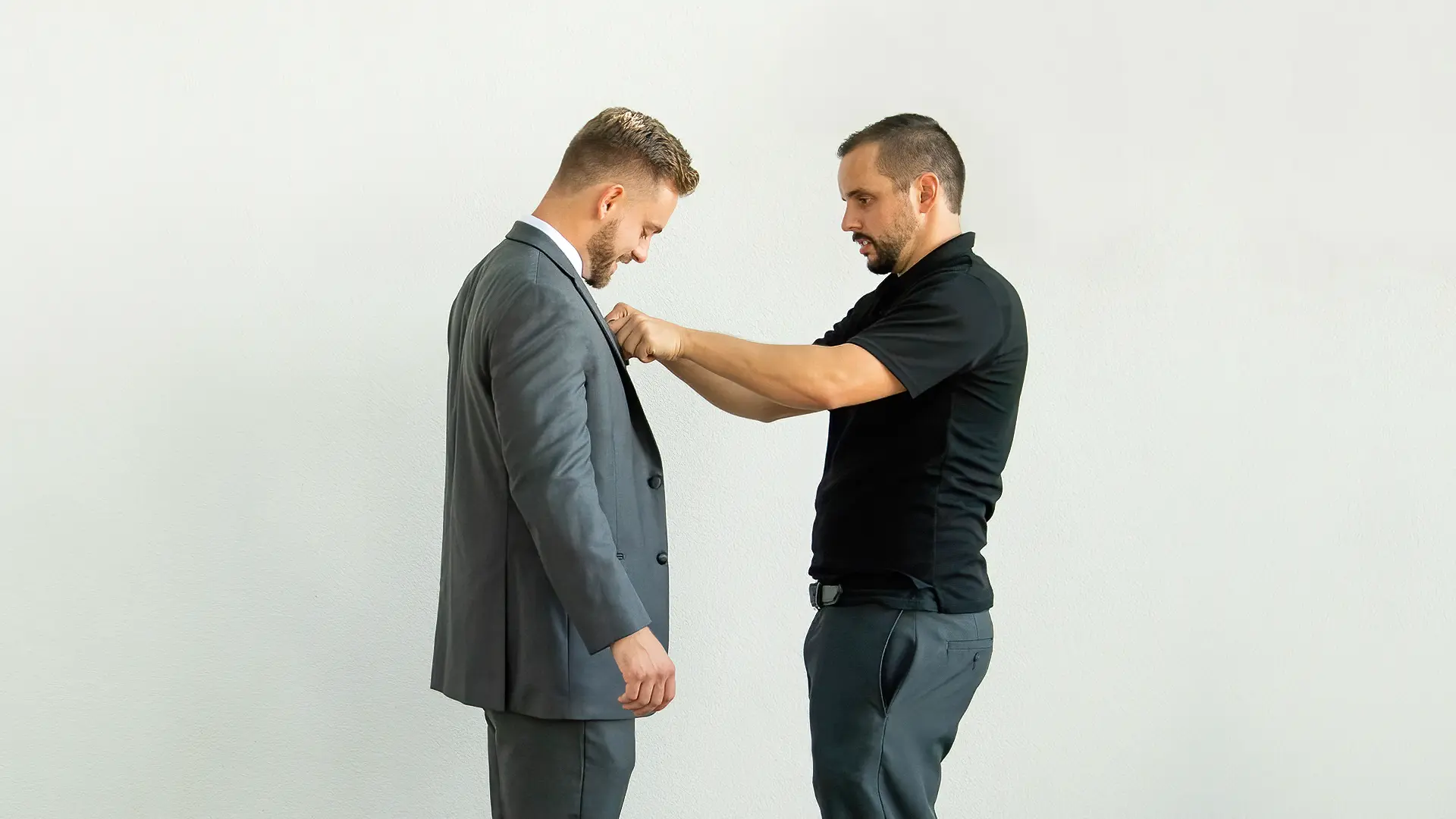 Dalton adjusting a man's tie